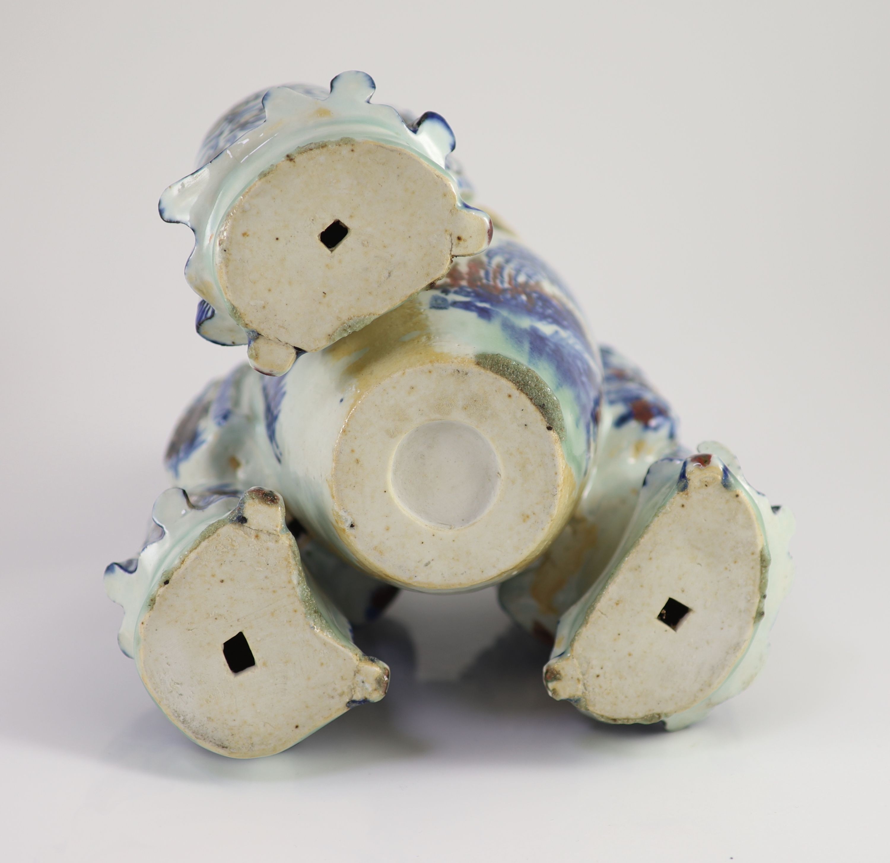 A rare Chinese underglaze blue and copper red porcelain model of the ‘Vinegar Tasters’, Qing dynasty, 26.cm high
